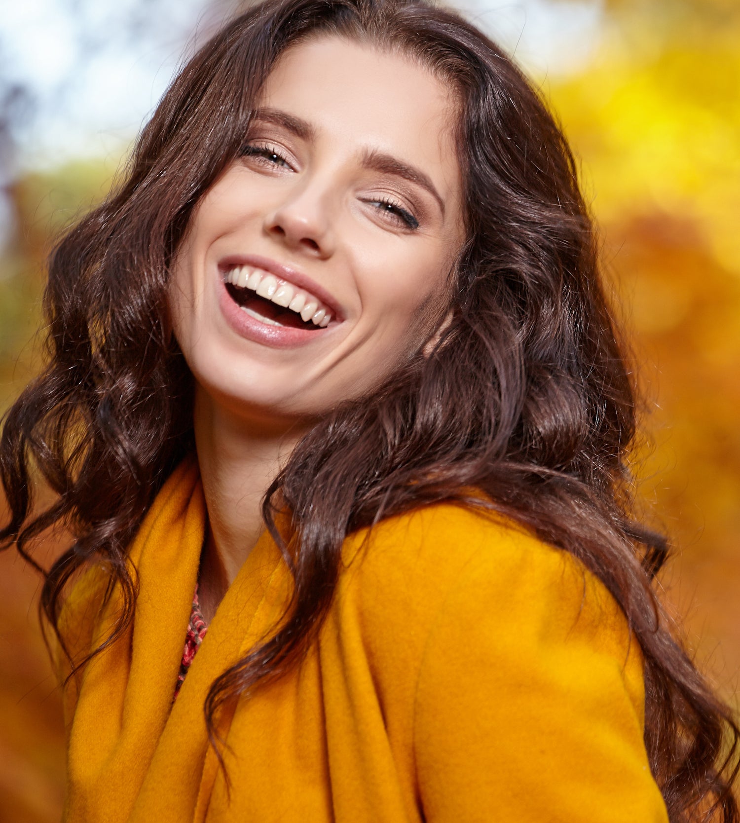woman with long hair happy and smiling because of enclare hormonal imbalance products.