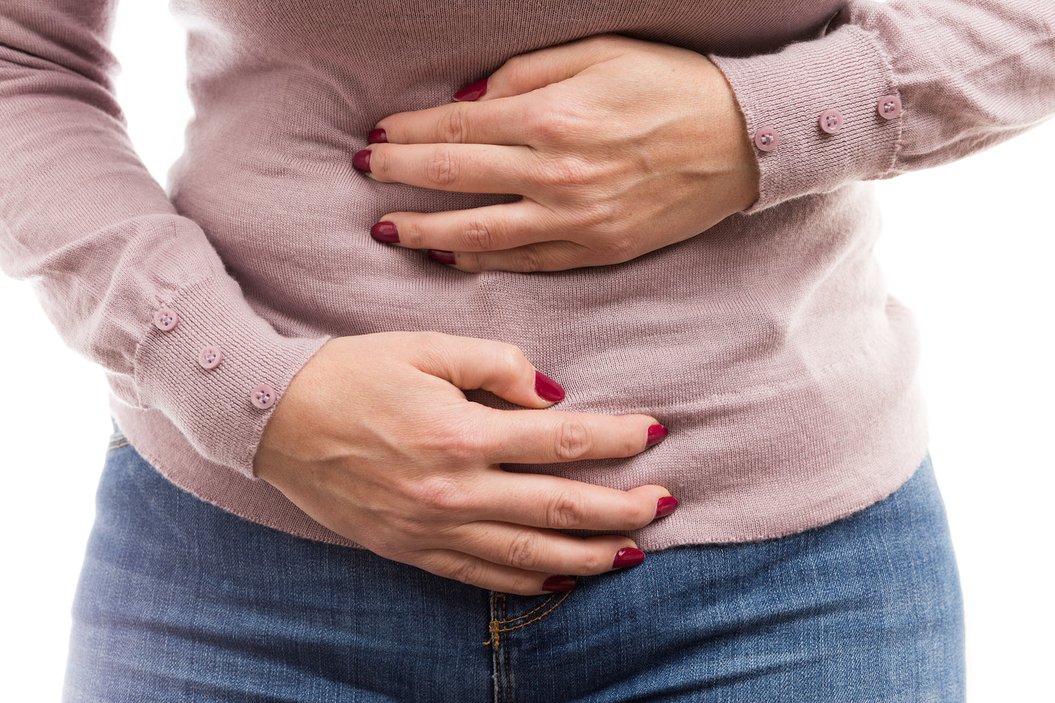 woman holding her tummy area because of pain, she needs one of enclare detox products.